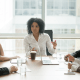 Female boss with colleagues