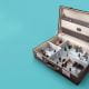 miniature office in a briefcase rooms employees blue background
